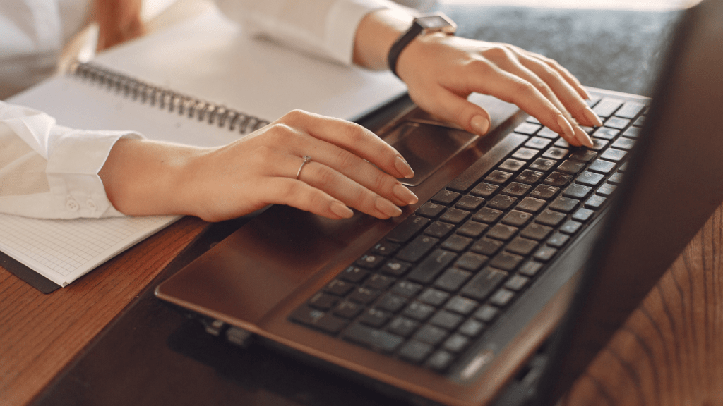 Woman typing on Keyboard