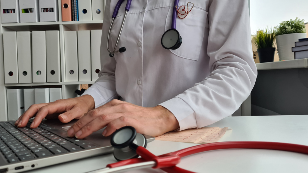 Doctor using laptop